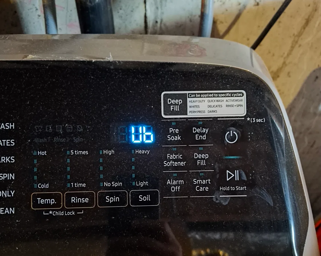 Samsung top-load washer control panel showing the Ub unbalanced load code