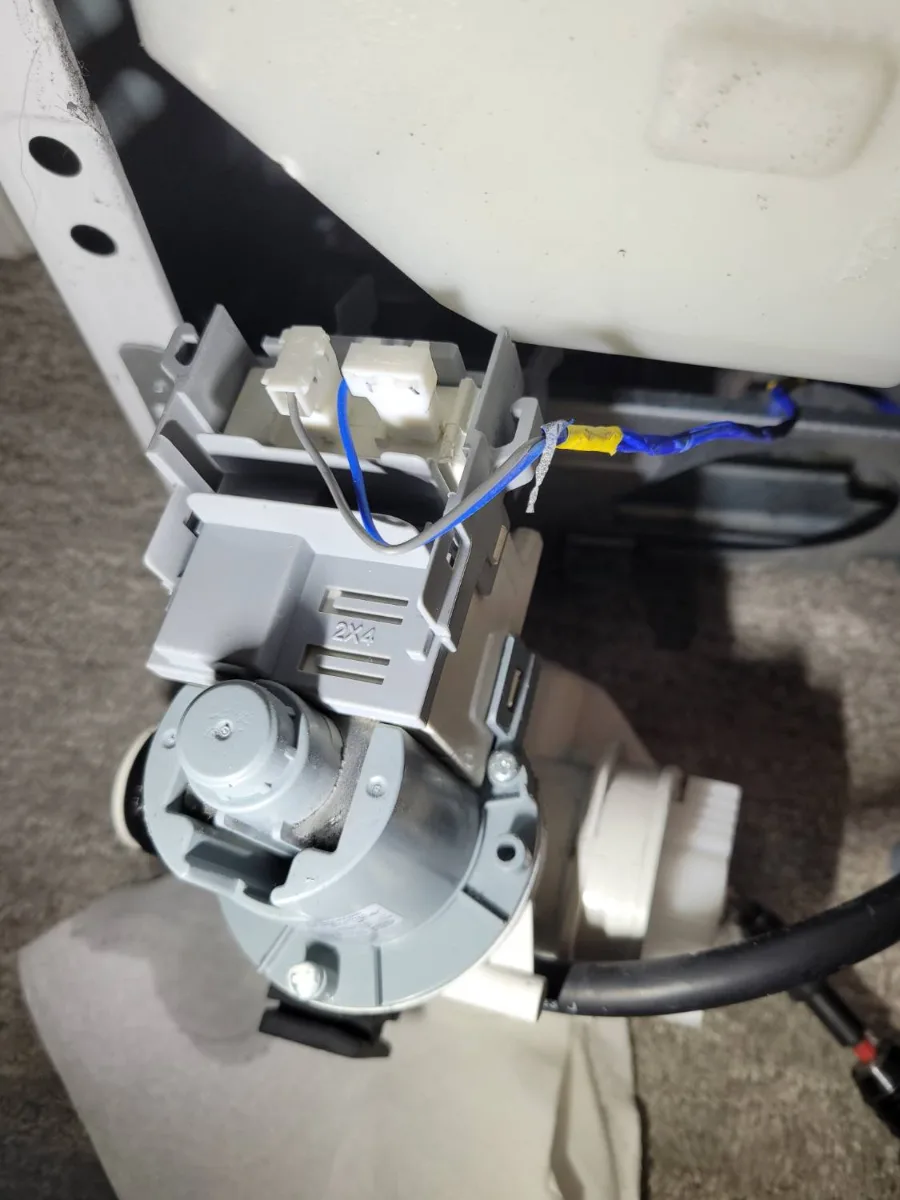 Drain pump assembly removed from a Samsung washer