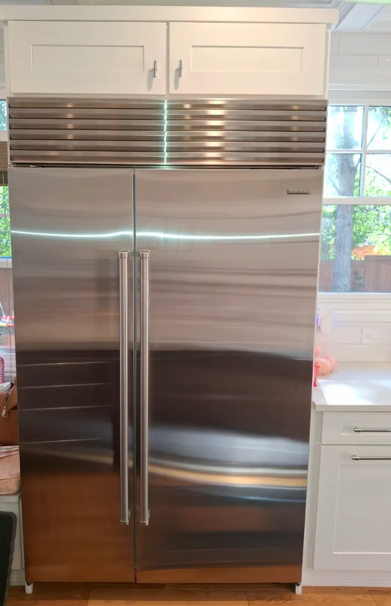 Stainless Sub-Zero built-in side-by-side refrigerator in a Denver-area kitchen