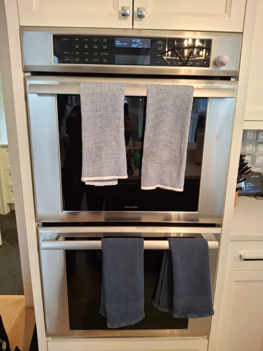 Thermador double wall oven in a kitchen with white cabinets