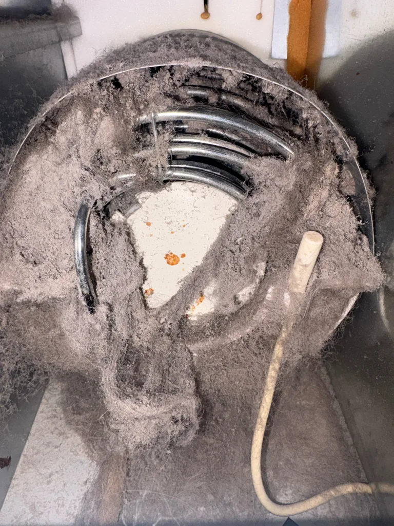 Fan packed with dust in a Thermador refrigerator that was not cooling