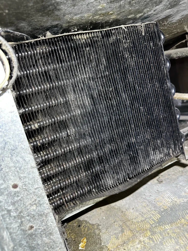Dust-packed condenser on a True refrigerator