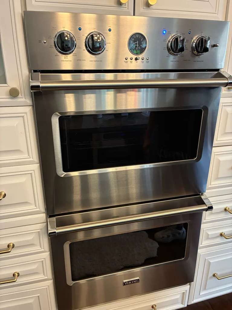 Viking stainless double wall oven in a custom kitchen