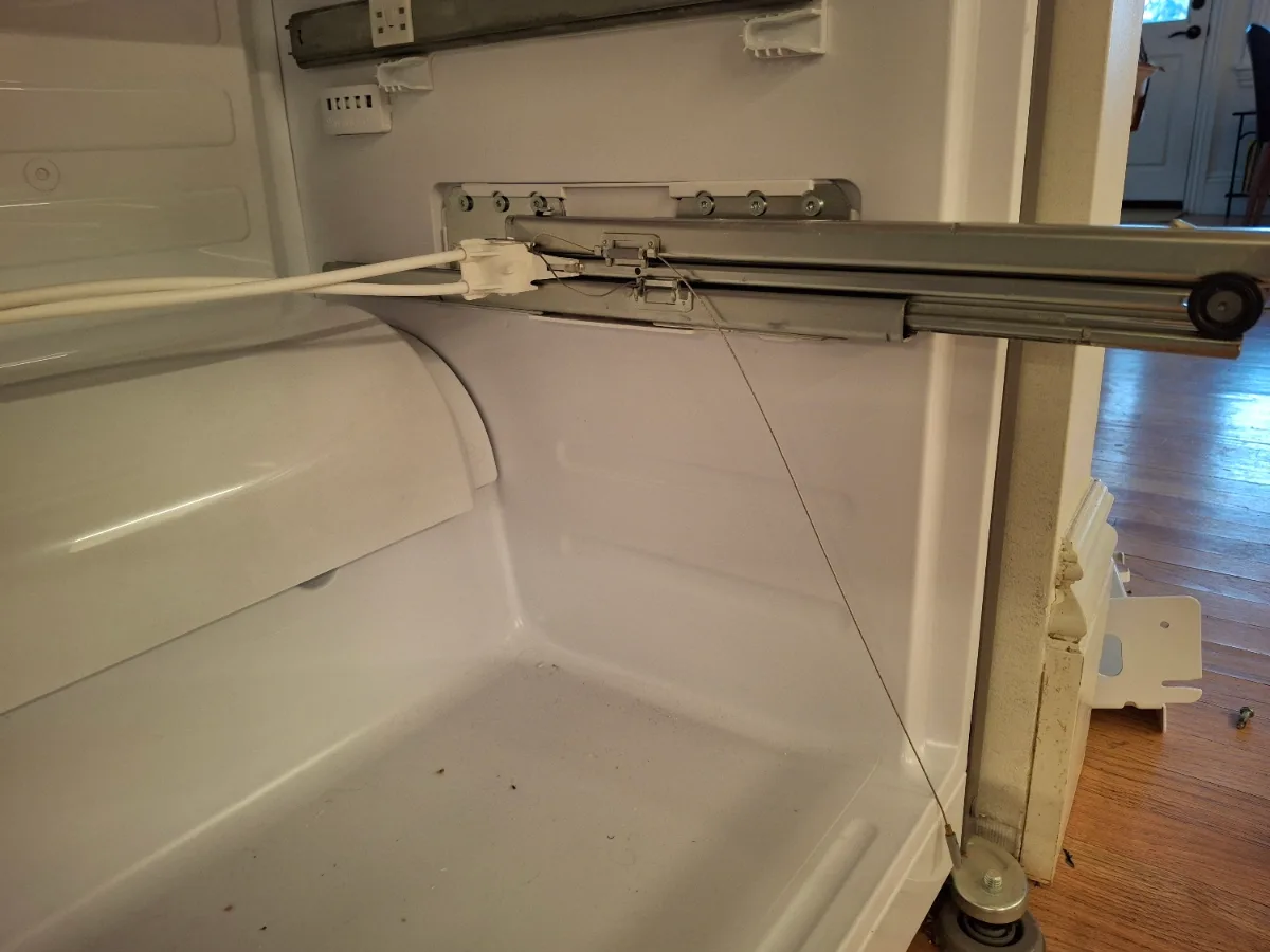 Freezer drawer slides and cables of a Viking bottom-freezer refrigerator