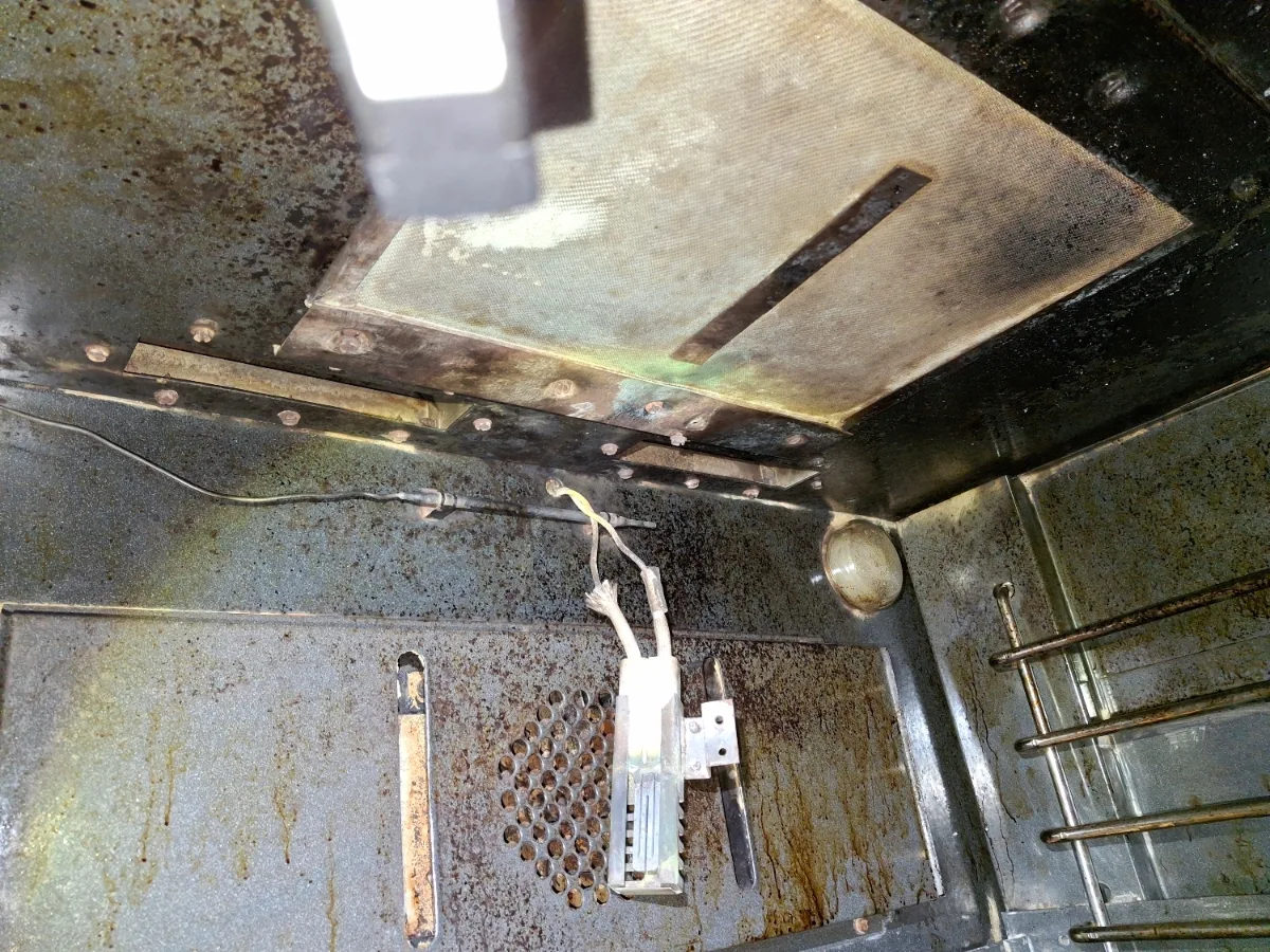 Broil burner and igniter at the top of a Viking oven