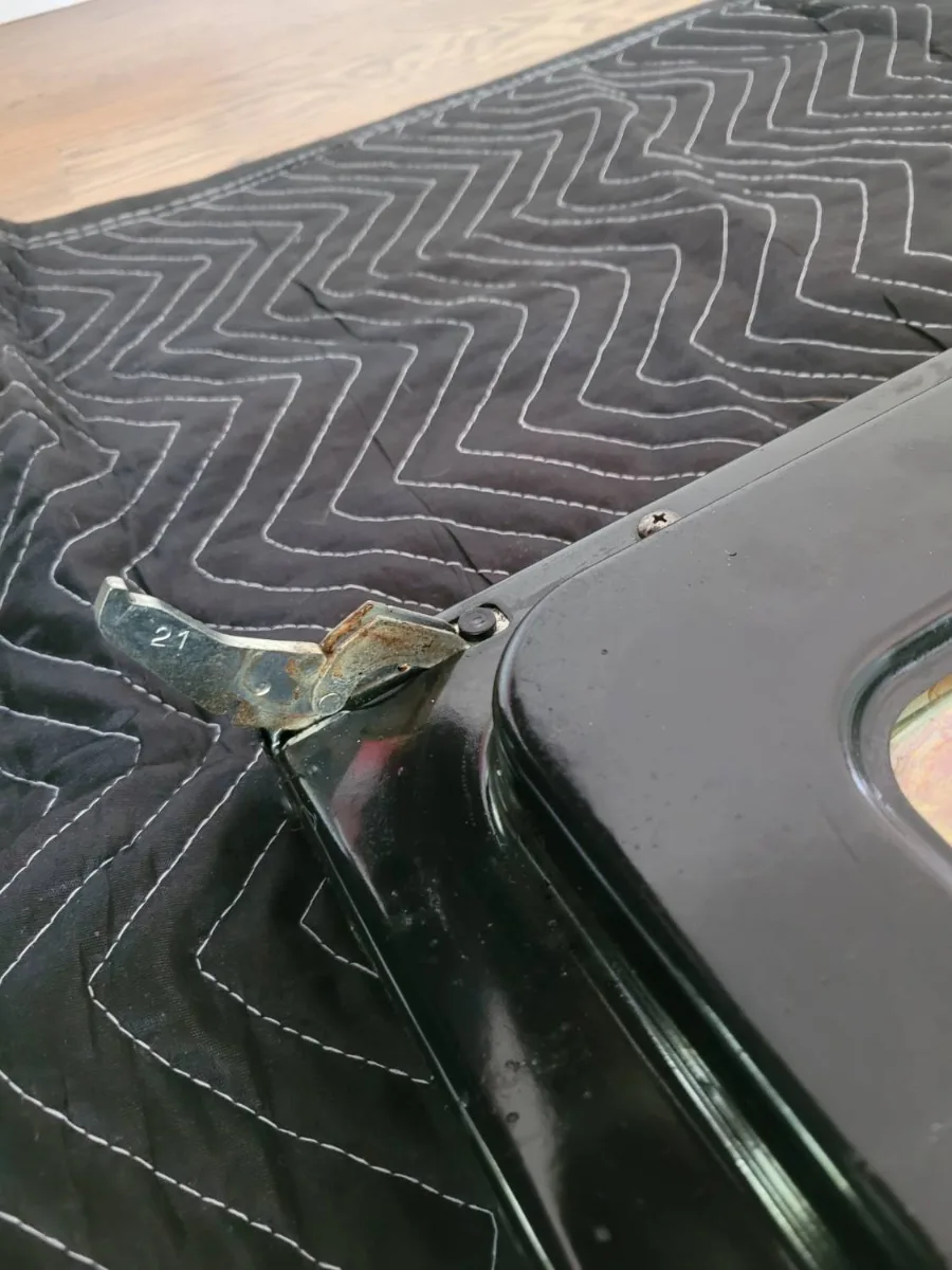 Viking oven door off the range on a moving blanket for hinge repair