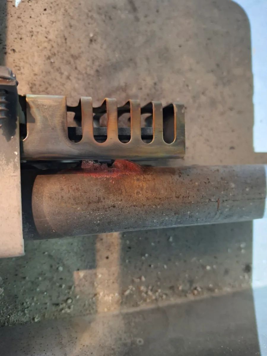 Igniter next to the gas burner ports in a Viking oven