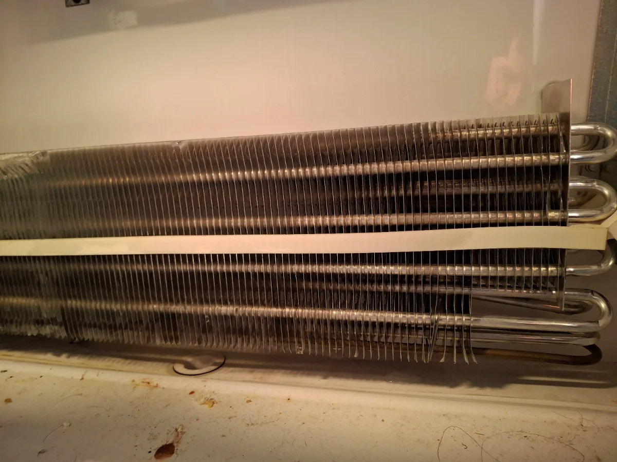 Condenser coil of an older Viking built-in refrigerator