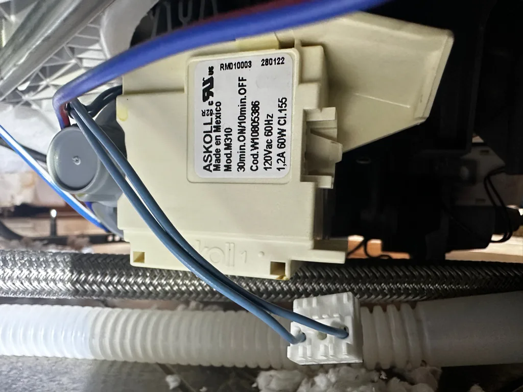 Circulation pump and motor under a Whirlpool dishwasher