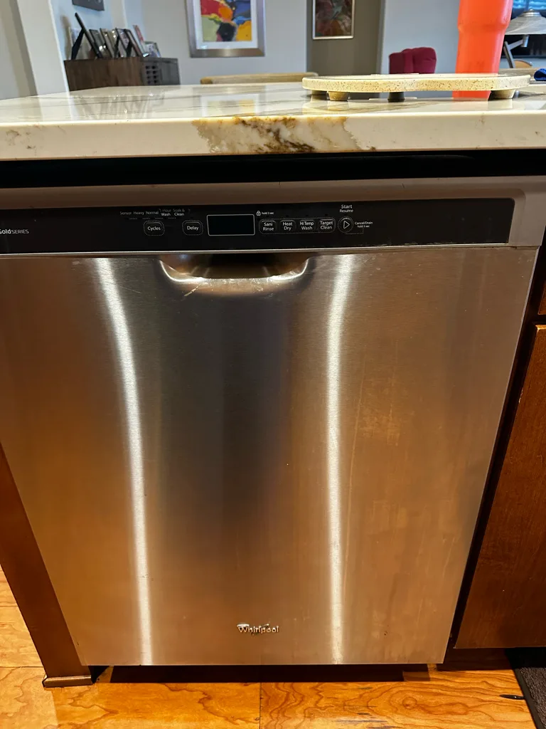 Stainless steel Whirlpool built-in dishwasher in a Denver-area kitchen