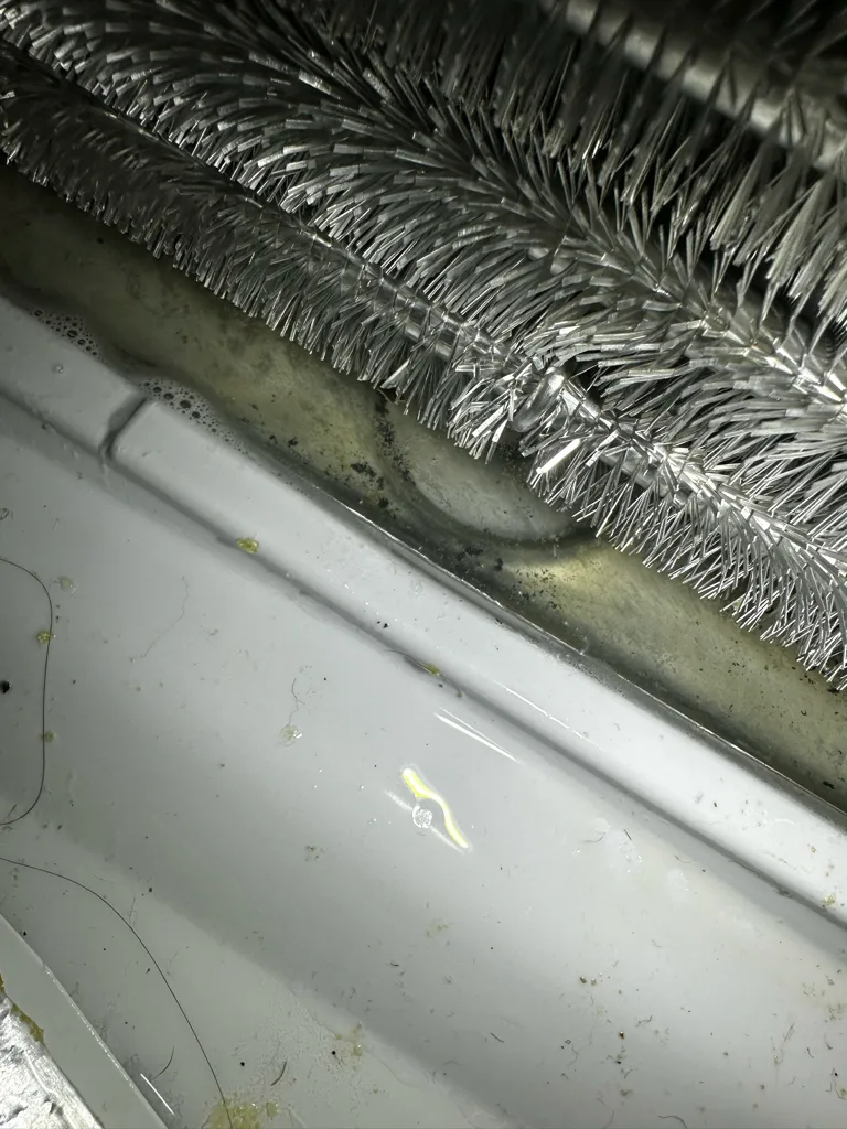 Heavy frost on the evaporator coil of a Whirlpool refrigerator