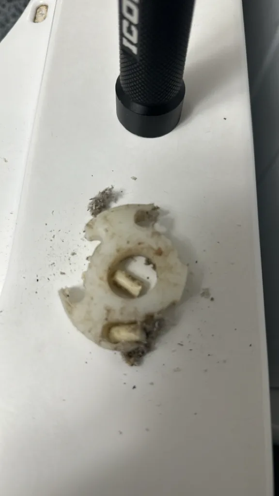 Broken drive motor coupler from a Whirlpool top-load washer