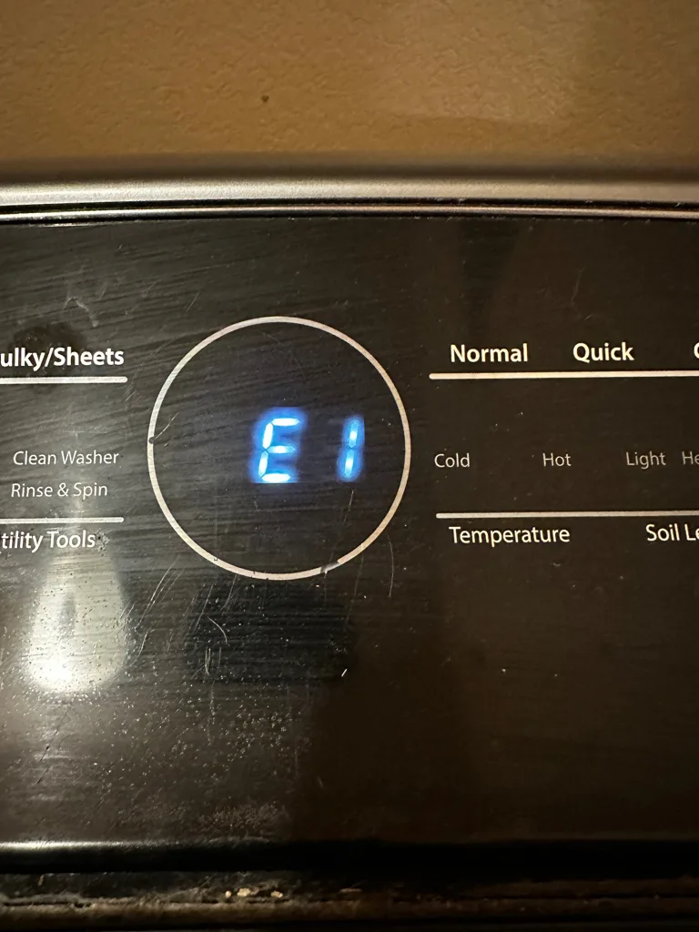 Whirlpool washer display showing E1, the second half of the F9 E1 drain code