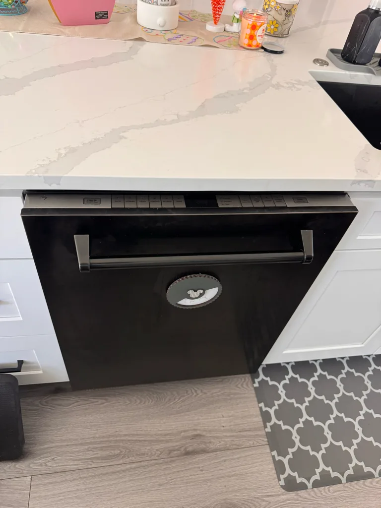 Stainless ZLINE dishwasher under a quartz counter